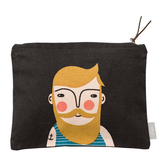 Black zippered toiletry bag with man with mustard yellow hair, beard and mustache. He wears a blue and white striped tank and an anchor tattoo on his arm.