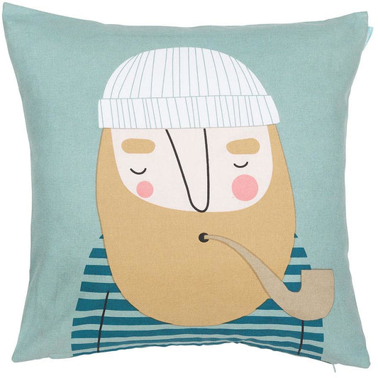 Light turquoise cushion cover with man's face with white beanie, tan beard, pipe and blue striped shirt.