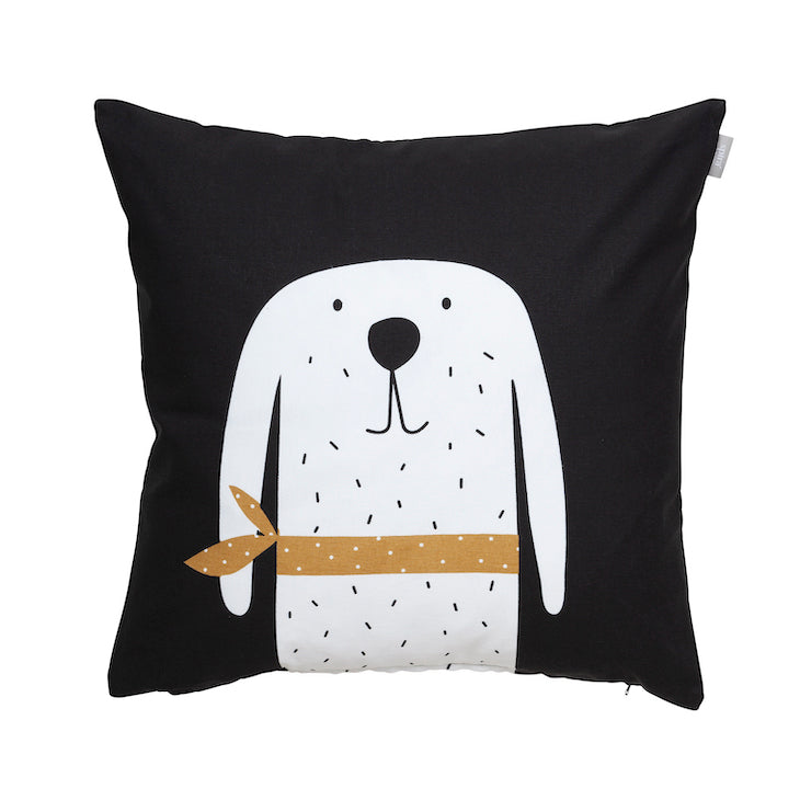 Black square pillow with large illustration of a dog bust. Dog is white with black specks, eyes and nose wearing a mustard yellow and white bandana. 