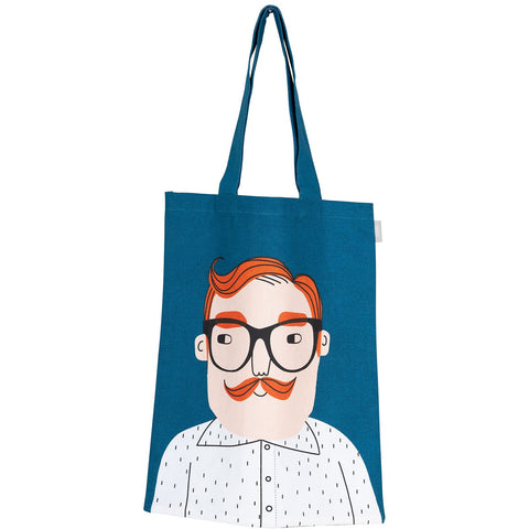 Blue tote bag with man's face with orange hair and mustache wearing black eyeglasses and a white button down shirt.