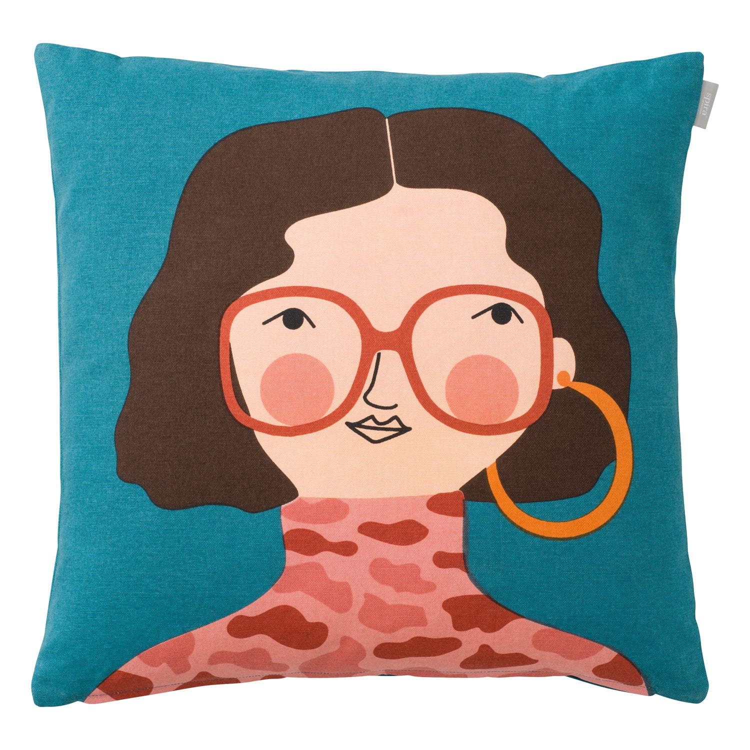 Teal colored cushion cover with women's face with brown hair and orange glasses.
