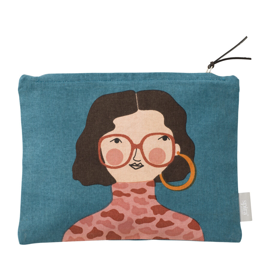 Teal zipped toiletry bag with women's face with brown hair, orange glasses and pink leopard print turtleneck.