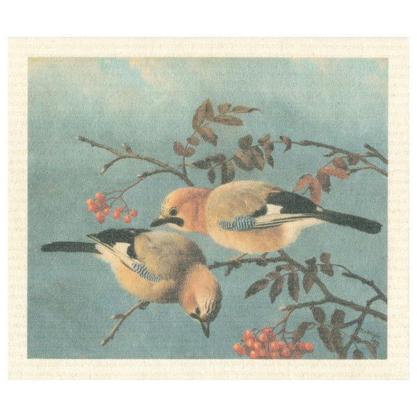 Dishcloth with design of a painting of two jay birds on a branch with orange berries on a blue background.