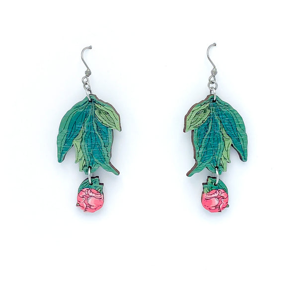 Photos of two green leafy earrings with small pink peony buds hanging from the bottom on  a white background.