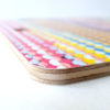 Corner of Rag Rug Cutting Board by Mieli Design