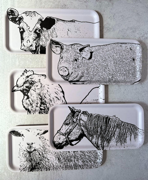 group of 5 long and narrow trays each with a farm animal, cow, pig, chicken, horse and sheep in black and white on a light background.